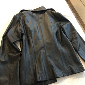 Women’s black leather jacket.